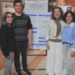 Pesquisadores diante do pôster sobre o desenvolvimento de creme cosmético enriquecido com compostos bioativos da bocaiuv