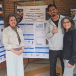 Pesquisadores diante do pôster sobre a caracterização nutricional e funcional do extrato proteico de baru.